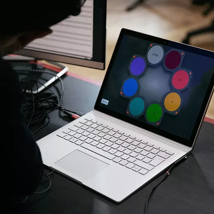 laptop with music notes on screen