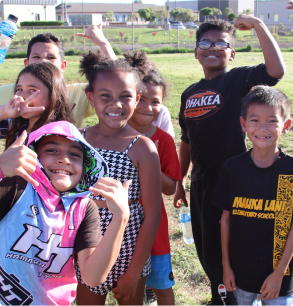 A group of kids posing for a picture.