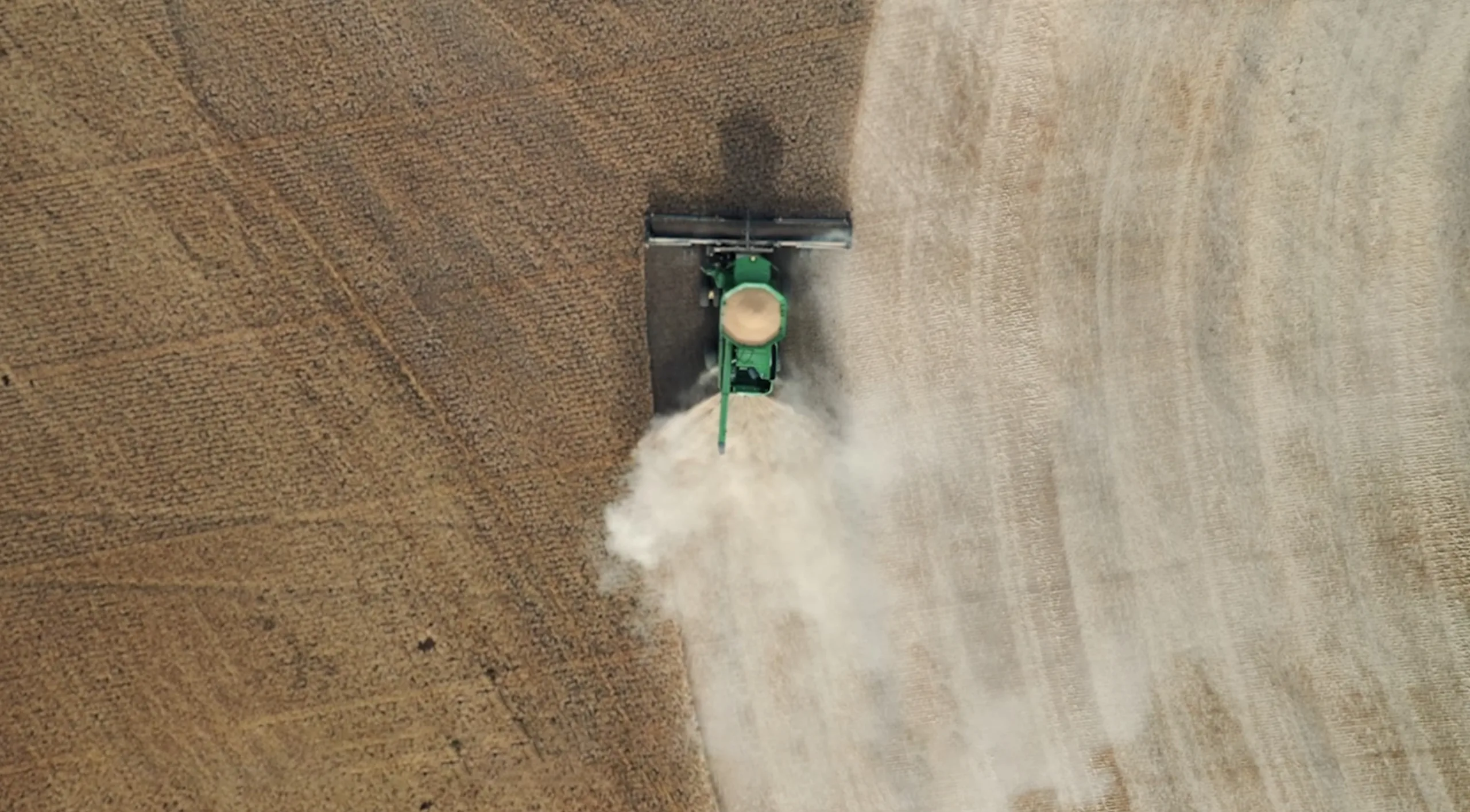 An aerial view of a tractor in a field.