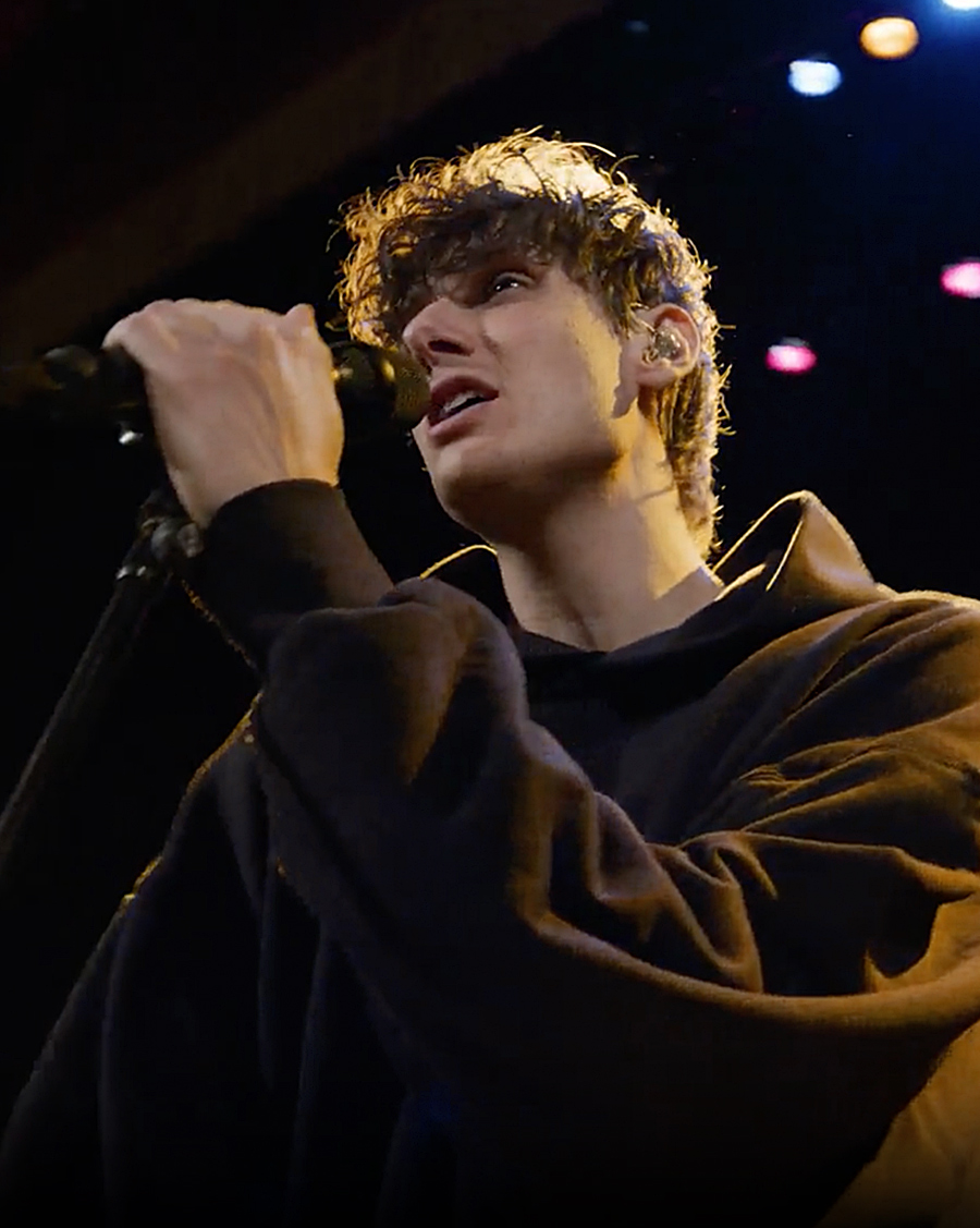 Man on stage singing