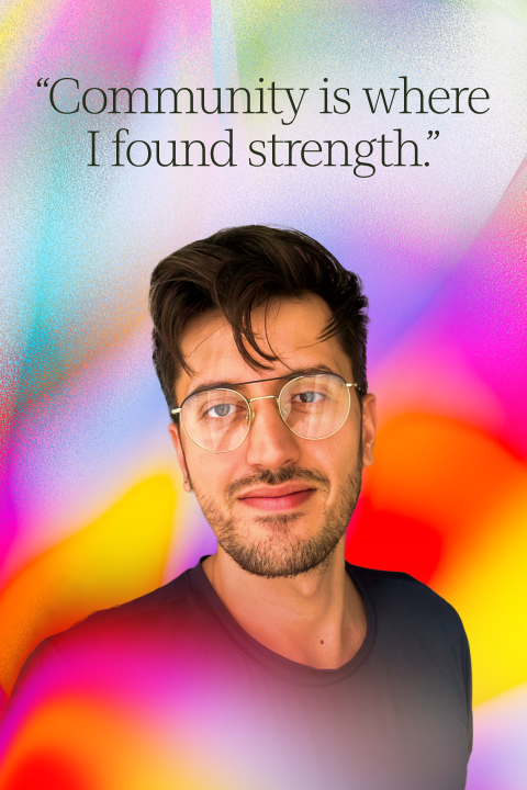 A person with glasses and a beard stands in front of a colorful, abstract background. Text above reads: "Community is where I found strength.