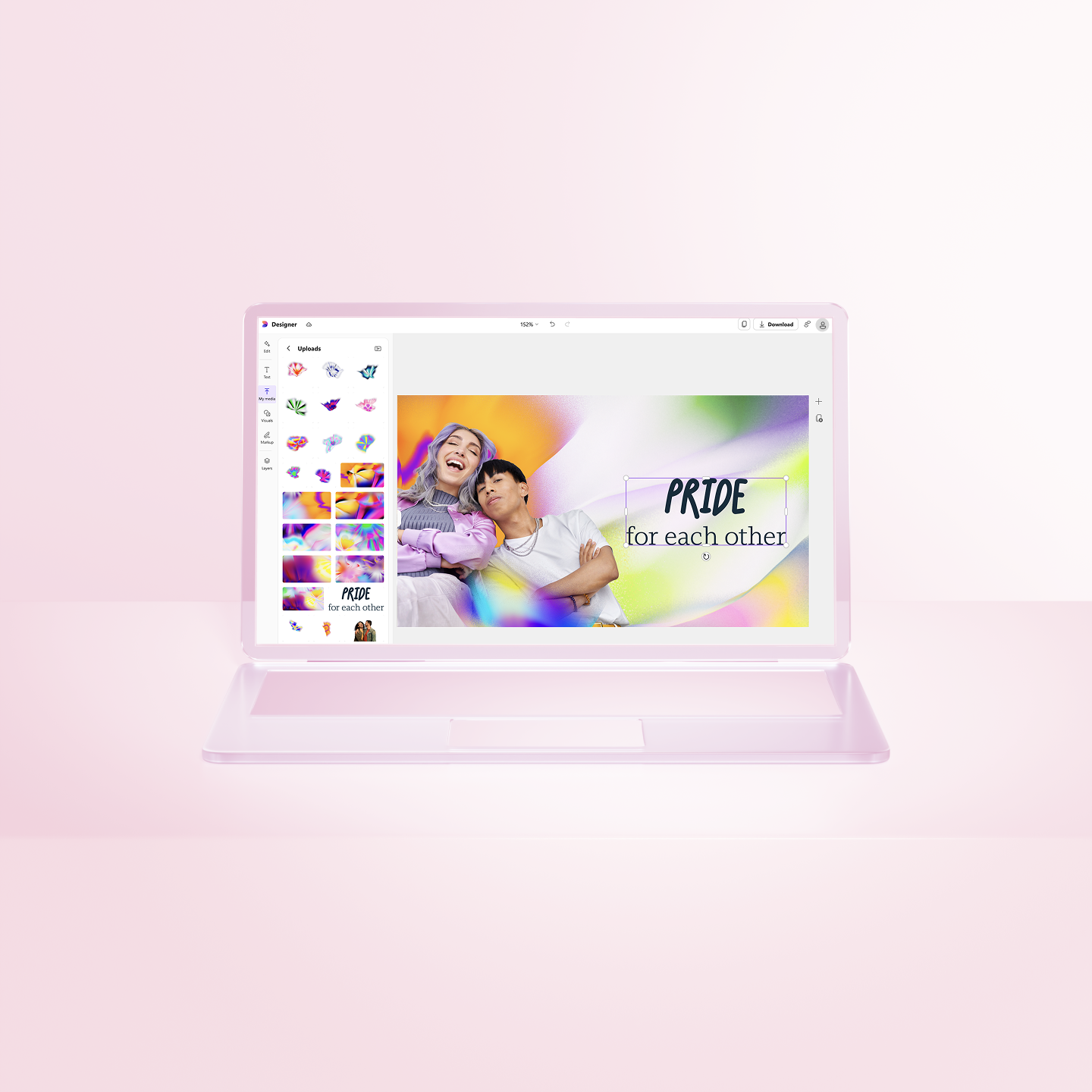 A laptop displays a design program with an image of two people embracing and the text "PRIDE for each other" on a colorful background. The laptop sits on a pink surface.
