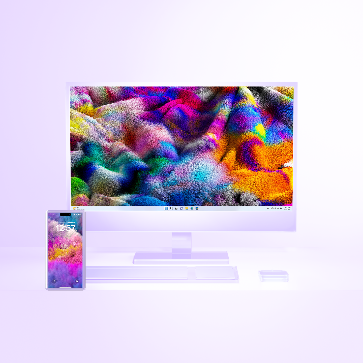 A smartphone and a desktop computer with vibrant, colorful abstract art displayed on both screens, set against a light background.