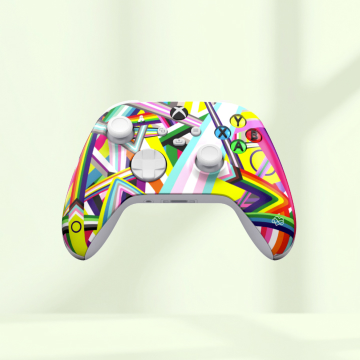 A white gaming controller with a colorful, geometric abstract pattern on the front, featuring buttons and joysticks, set against a plain light background.